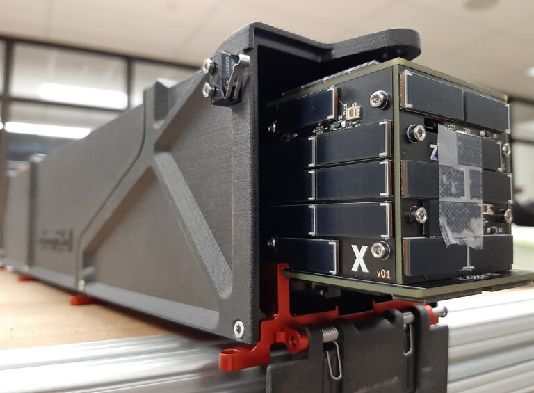Fit check of 3D printed AlbaPod 2.0 with University of Stanford's 1P PocketQube, 'PyCubed', which will fly on Alba Cluster 3. Courtesy of Alba Orbital